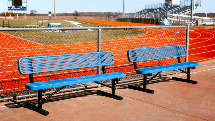 Commercial outdoor benches installed along track and field stadium seating area