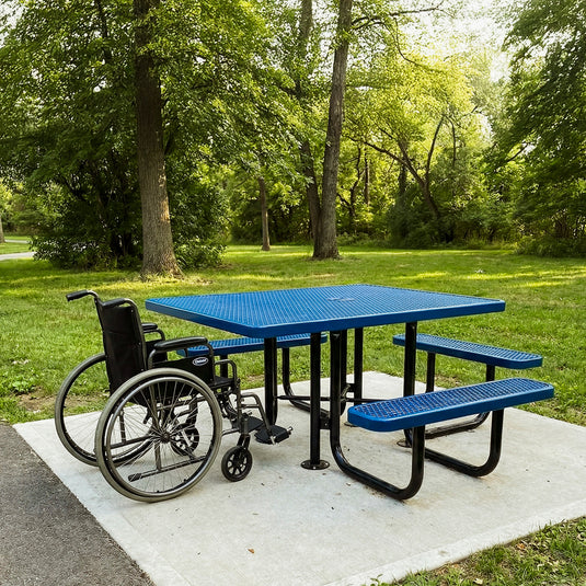 Blue picnic table with wheelchair accessible features in a park setting